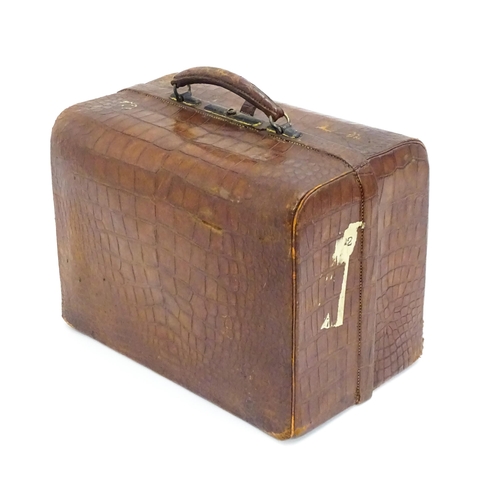 648 - A leather vanity / valise travelling case having fitted section within with various Victorian silver... 