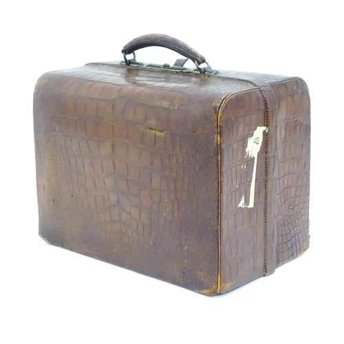 648 - A leather vanity / valise travelling case having fitted section within with various Victorian silver... 