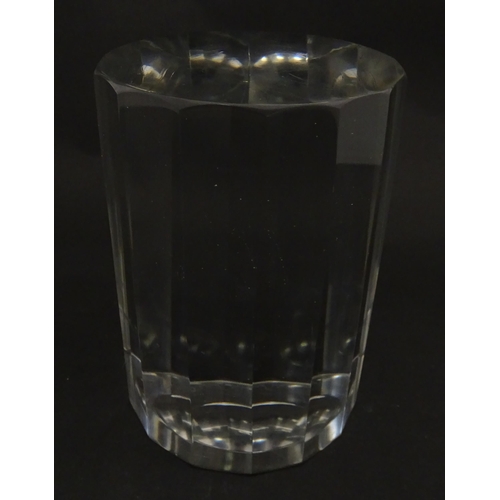 296 - A solid clear glass plinth / stand with 14 facet sides. Approx  5 1/2