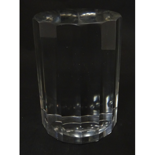 296 - A solid clear glass plinth / stand with 14 facet sides. Approx  5 1/2