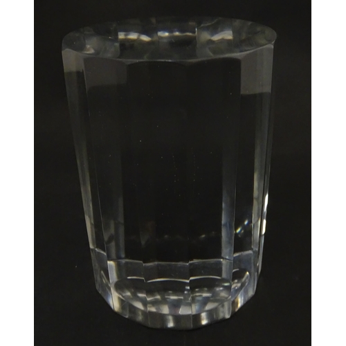 296 - A solid clear glass plinth / stand with 14 facet sides. Approx  5 1/2