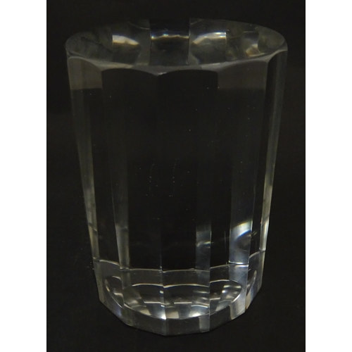 296 - A solid clear glass plinth / stand with 14 facet sides. Approx  5 1/2