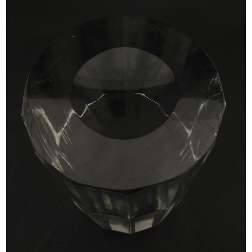 296 - A solid clear glass plinth / stand with 14 facet sides. Approx  5 1/2