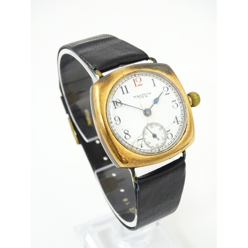 1035 - An American Waltham USA gentlemans 9ct gold cased wristwatch, the white enamel dial with Arabic nume... 