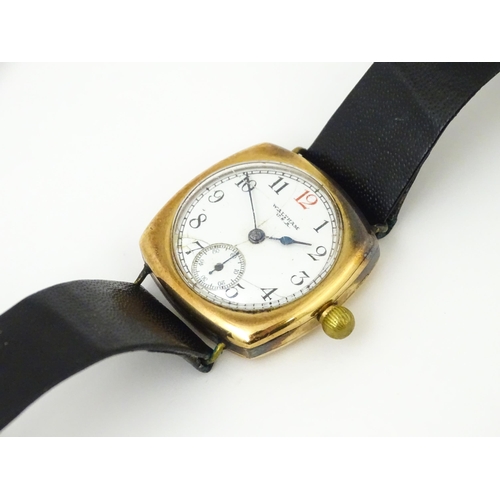 1035 - An American Waltham USA gentlemans 9ct gold cased wristwatch, the white enamel dial with Arabic nume... 