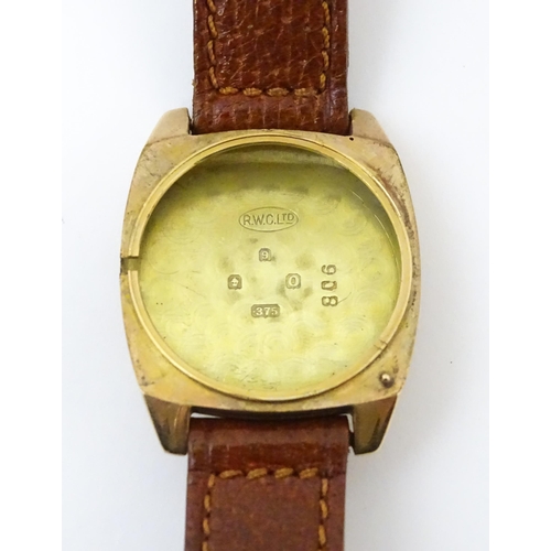 1036 - A vintage 9ct gold cased Rolex manual wind wristwatch the dial with Arabic numerals and subsidiary s... 