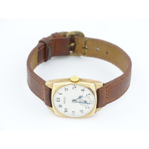 1036 - A vintage 9ct gold cased Rolex manual wind wristwatch the dial with Arabic numerals and subsidiary s... 