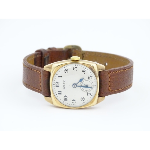 1036 - A vintage 9ct gold cased Rolex manual wind wristwatch the dial with Arabic numerals and subsidiary s... 