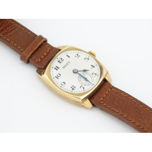 1036 - A vintage 9ct gold cased Rolex manual wind wristwatch the dial with Arabic numerals and subsidiary s... 