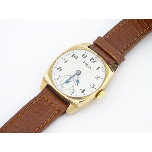 1036 - A vintage 9ct gold cased Rolex manual wind wristwatch the dial with Arabic numerals and subsidiary s... 