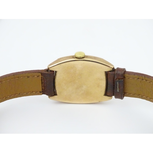 1036 - A vintage 9ct gold cased Rolex manual wind wristwatch the dial with Arabic numerals and subsidiary s... 