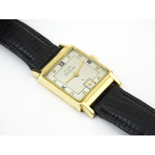 1037 - A vintage Elgin Deluxe 10k gold filled gentlemans wristwatch with squared dial and subsidiary second... 