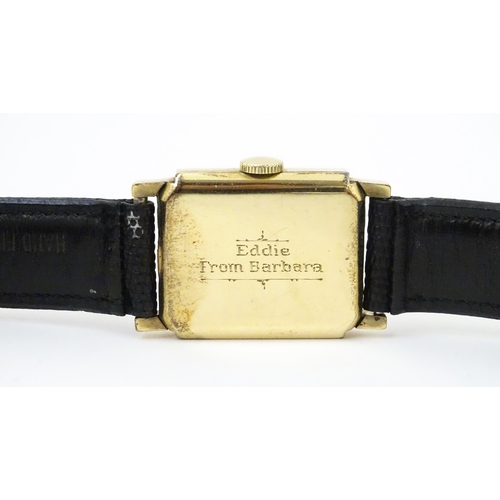 1037 - A vintage Elgin Deluxe 10k gold filled gentlemans wristwatch with squared dial and subsidiary second... 