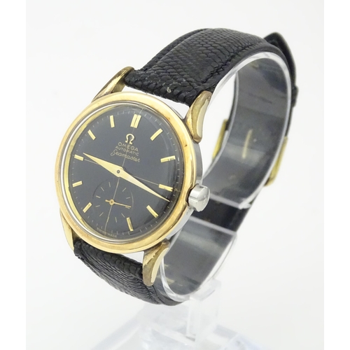 1040 - A gentlemans automatic stainless steel cased wristwatch the black dial signed 'Omega Automatic Seama... 