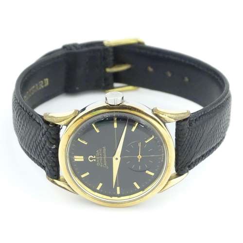 1040 - A gentlemans automatic stainless steel cased wristwatch the black dial signed 'Omega Automatic Seama... 