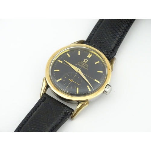 1040 - A gentlemans automatic stainless steel cased wristwatch the black dial signed 'Omega Automatic Seama... 