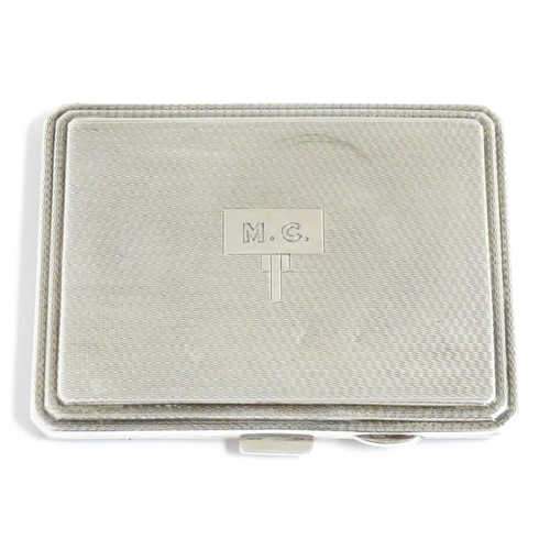 340 - An Art Deco silver compact of rectangular form with engine turned decoration hallmarked Birmingham 1... 