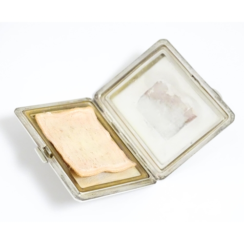 340 - An Art Deco silver compact of rectangular form with engine turned decoration hallmarked Birmingham 1... 