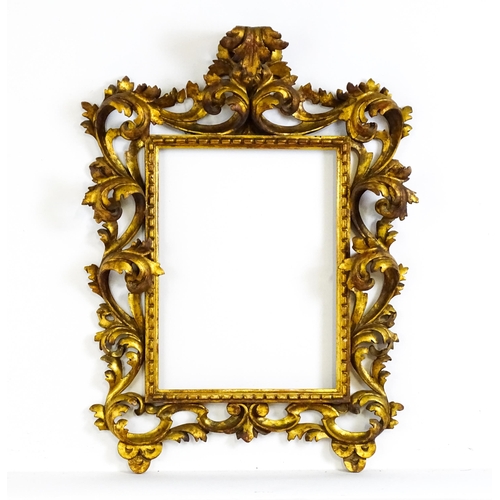 2096 - An early 20thC Italian carved giltwood Florentine style frame with elaborate acanthus scroll detail.... 