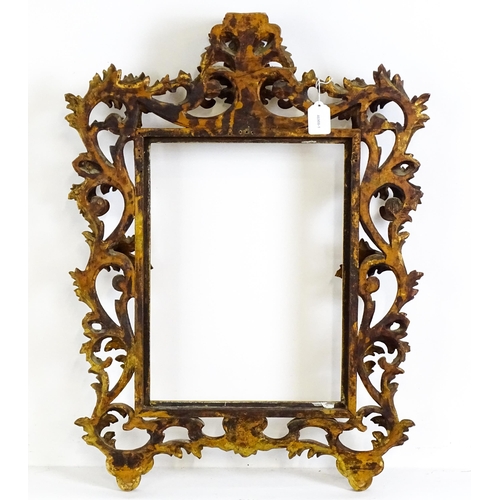 2096 - An early 20thC Italian carved giltwood Florentine style frame with elaborate acanthus scroll detail.... 