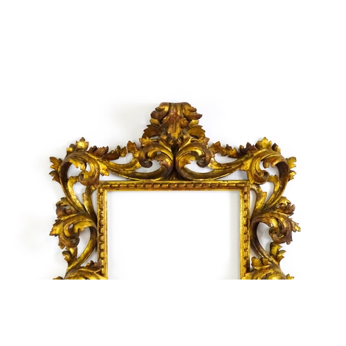 2096 - An early 20thC Italian carved giltwood Florentine style frame with elaborate acanthus scroll detail.... 