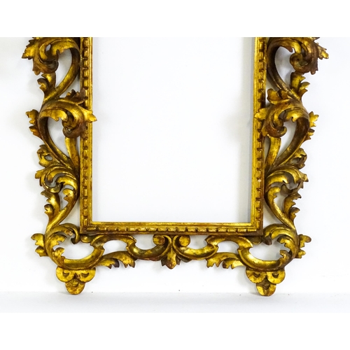 2096 - An early 20thC Italian carved giltwood Florentine style frame with elaborate acanthus scroll detail.... 