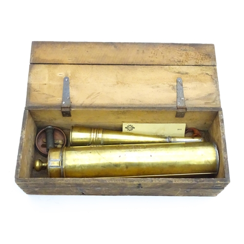 1414 - An early 20thC brass sailing barge foghorn / signal horn, in a pine case containing spare pitch valv... 