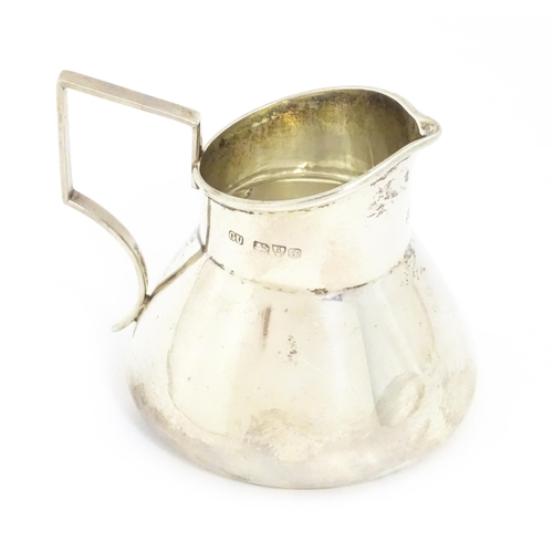 645 - A silver cream jug hallmarked Chester 1909, maker George Unite. Approx. 2 1/2