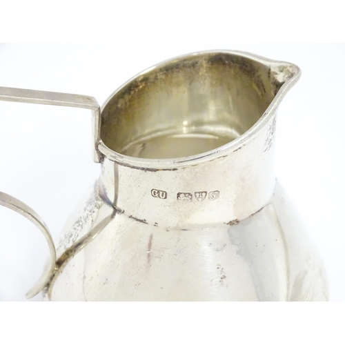 645 - A silver cream jug hallmarked Chester 1909, maker George Unite. Approx. 2 1/2