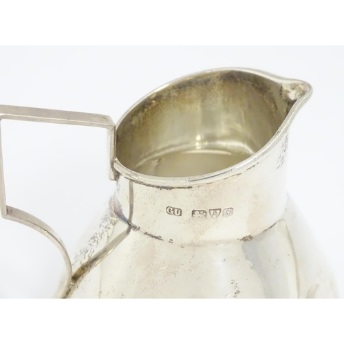 645 - A silver cream jug hallmarked Chester 1909, maker George Unite. Approx. 2 1/2