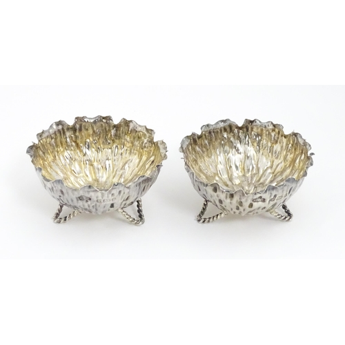 646 - A pair of Arts & Crafts silver salts / small dishes hallmarked Birmingham 1900, maker Sydney Thomas ... 