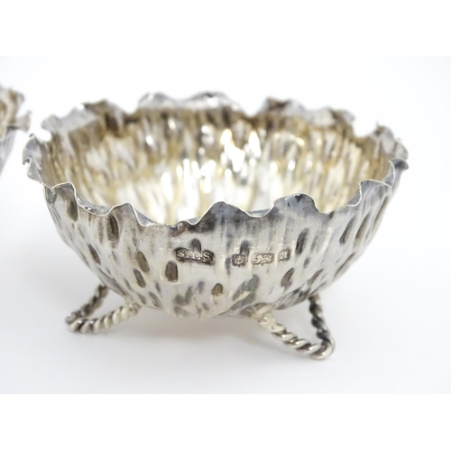 646 - A pair of Arts & Crafts silver salts / small dishes hallmarked Birmingham 1900, maker Sydney Thomas ... 