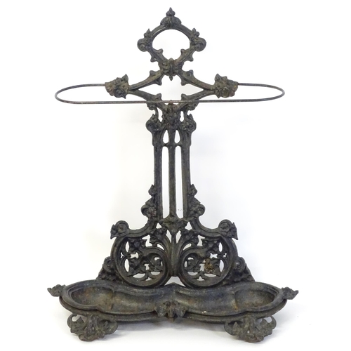 1417 - A late 19th / early 20thC cast iron stick stand with scrolling foliate detail. Impressed No. 100227 ... 