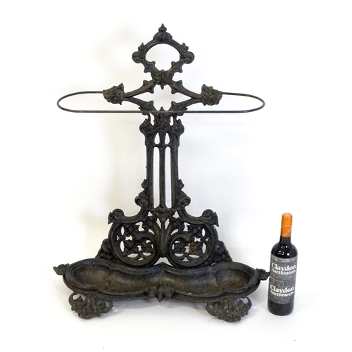 1417 - A late 19th / early 20thC cast iron stick stand with scrolling foliate detail. Impressed No. 100227 ... 