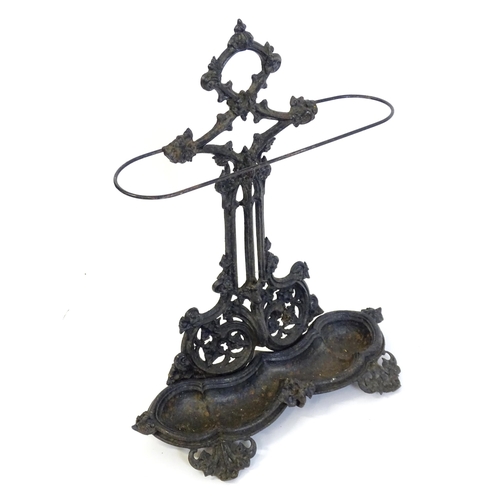 1417 - A late 19th / early 20thC cast iron stick stand with scrolling foliate detail. Impressed No. 100227 ... 