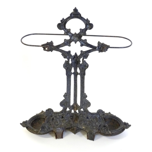 1417 - A late 19th / early 20thC cast iron stick stand with scrolling foliate detail. Impressed No. 100227 ... 