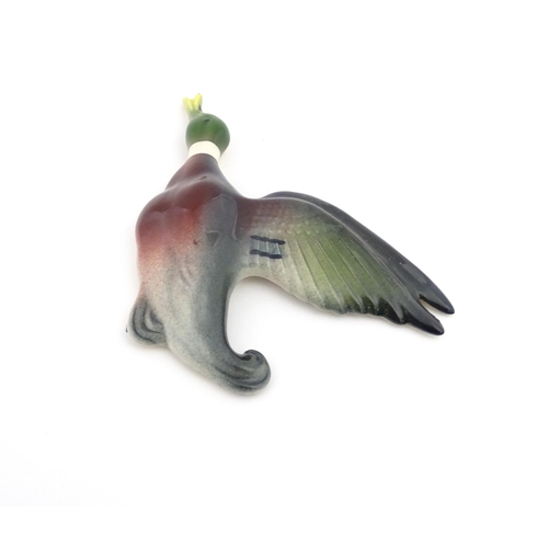 181A - A ceramic wall plaque modelled as a mallard duck in flight painted by Peter Scott. Marked under. App... 