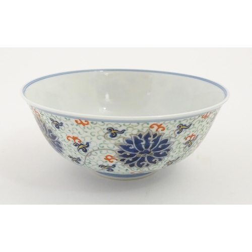 43 - A Chinese bowl decorated with scrolling floral and foliate detail. Character marks under. Approx. 3