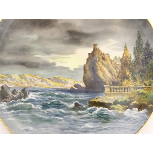 90 - An Italian charger with hand painted decoration depicting a seascape with crashing waves and a castl... 