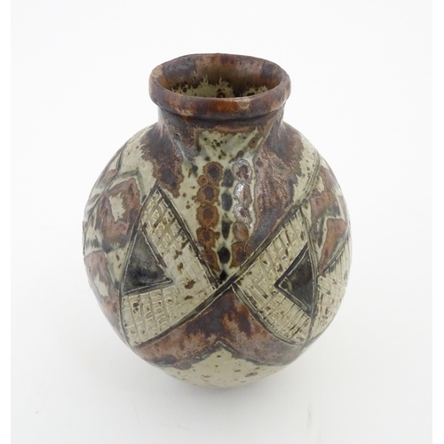 95 - A South African Rorke's Drift studio pottery vase with geometric decoration. In the manner of Dinah ... 