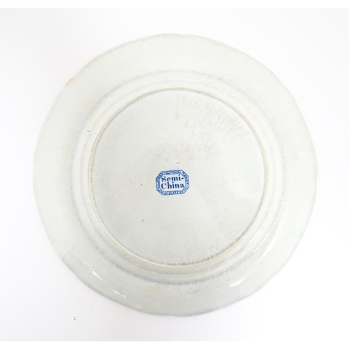 105 - A Minton blue and white plate in the Italian Ruins pattern. Marked under. Approx. 10