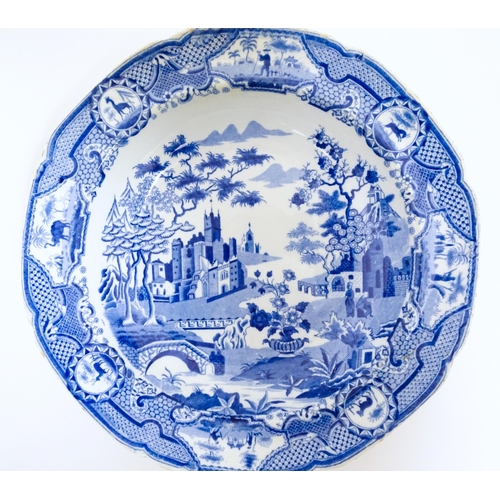 107 - A Spode blue and white plate in the Gothic Castle pattern. Impressed mark under. Approx. 9 1/2