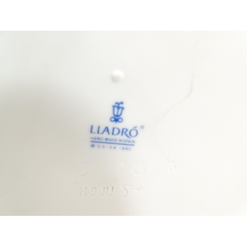 179 - A Lladro Pierrot clock no. 5778. Together with a Lladro figure A Time to Rest no. 5391. With boxes. ... 