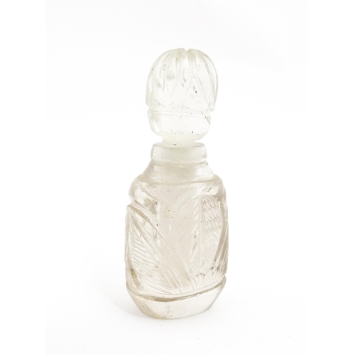 237 - A late 19th / early 20thC carved rock crystal perfume / scent bottle. Approx. 2 1/4