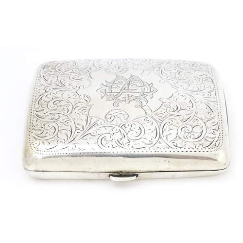 391 - A silver cigarette case of shaped form with engraved acanthus scroll decoration hallmarked Birmingha... 