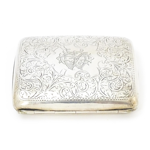 391 - A silver cigarette case of shaped form with engraved acanthus scroll decoration hallmarked Birmingha... 