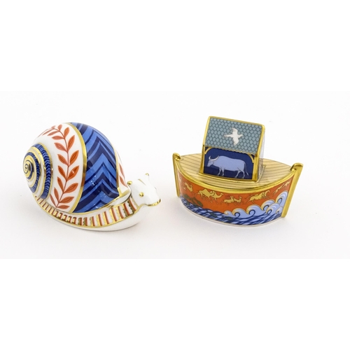 120 - Two Royal Crown Derby paperweights, one modelled as a snail, the other as Noah's Ark. Marked under. ... 