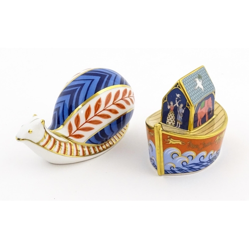 120 - Two Royal Crown Derby paperweights, one modelled as a snail, the other as Noah's Ark. Marked under. ... 