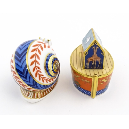 120 - Two Royal Crown Derby paperweights, one modelled as a snail, the other as Noah's Ark. Marked under. ... 