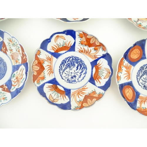 37 - Six assorted Japanese plates with scalloped edges decorated in the Imari palette with flowers, folia... 